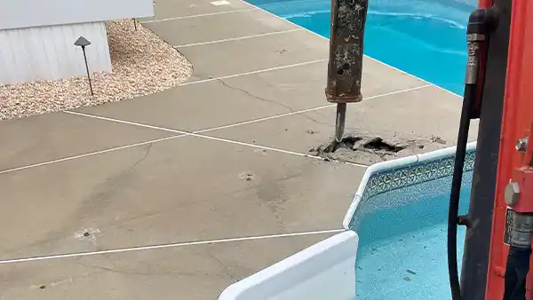 The second step is to begin breaking the pool after you have approved the project's budget and specifics. Step 2 of inground pool demolition