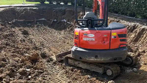 In step four, if you choose partial all the pool structure lies under the pool area, but if you choose full removal (everything was hauled away and you will see a solid soil structure in the area), here we are compacting the area already Step 4 of inground pool demolition